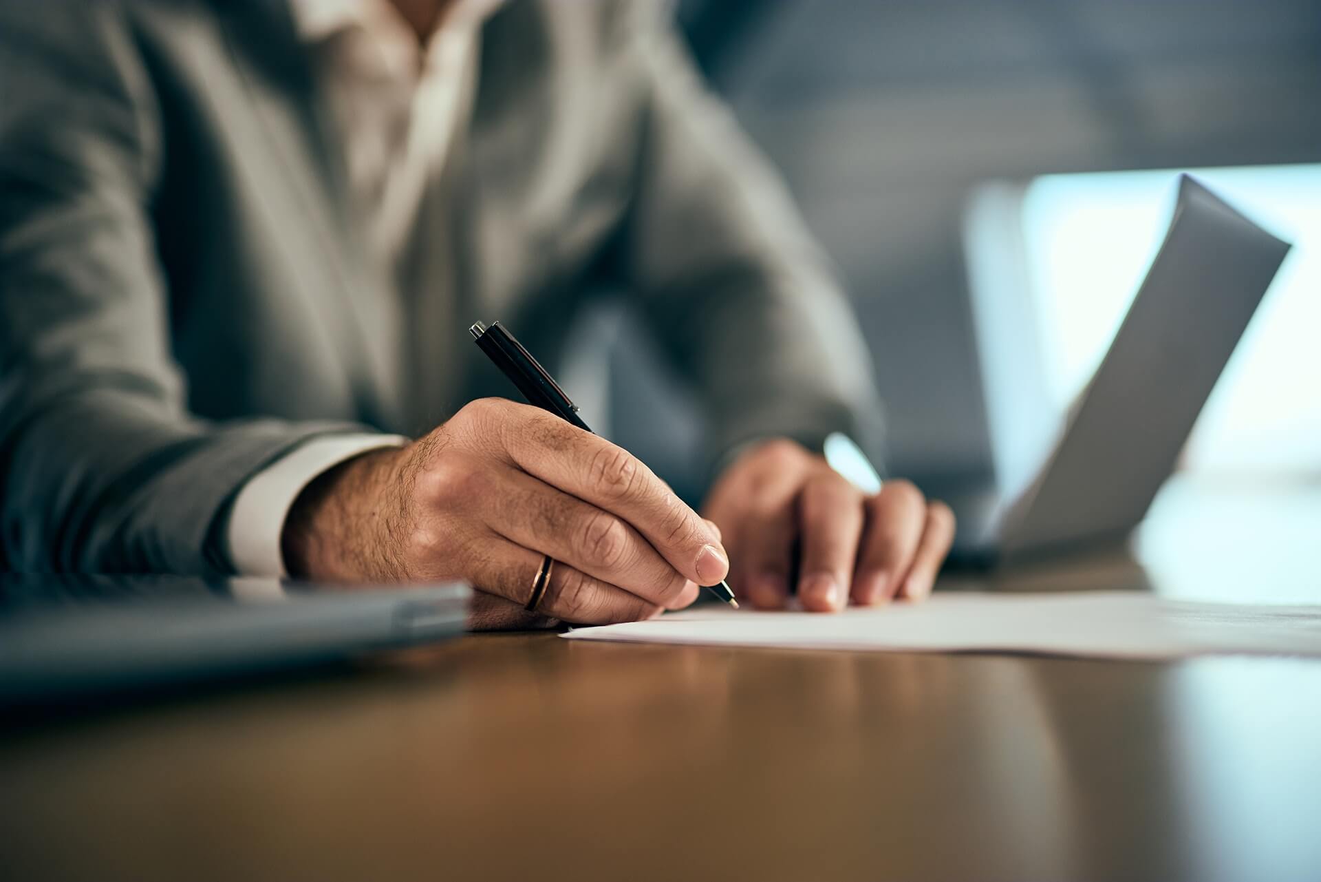 close up photo of a man in a suit signing a contra 2025 09 09 20 06 32 utc